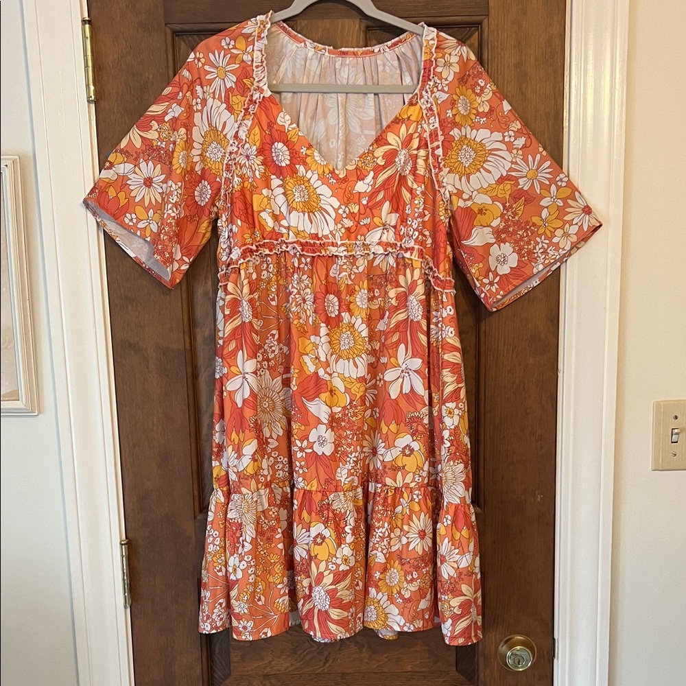 Orange and white ruffled bottom baby doll dress. Never worn size L